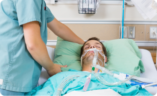 Intubated patient receiving ICU respiratory support